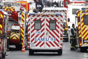 2015-11-18 11:58:57 epa05031080 An ambulance of the SAMU arrives at the site were a raid happened in the city center of Saint Denis, near Paris, France, 18 November 2015. Shots were heard as police raided a northern Paris suburb early 18 November in connection with last week's terrorist attacks. According to media reports, two people were dead, several police officers were injured and at least three people were arrested.  EPA/ETIENNE LAURENT