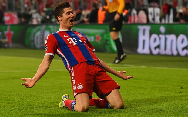 MUNICH, GERMANY - APRIL 21:  Robert Lewandowski of Bayern Muenchen celebrates scoring the fifth goal during the UEFA Champions League Quarter Final Second Leg match between FC Bayern Muenchen  and FC Porto at Allianz Arena on April 21, 2015 in Munich, Germany.  (Photo by Dennis Grombkowski/Bongarts/Getty Images)