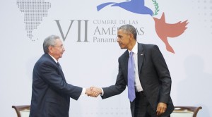 US President Barack Obama and Cuban President Raul Castro shake hands at the Summit of the Americas in Panama City, Panama, Saturday, April 11, 2015. (AP Photo/Pablo Martinez Monsivais)