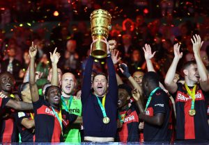 Soccer Football - DFB Cup - Final - 1.FC Kaiserslautern v Bayer Leverkusen - Olympiastadion, Berlin, Germany - May 25, 2024 Bayer Leverkusen coach Xabi Alonso celebrates with the trophy after winning the DFB Cup REUTERS/Wolfgang Rattay