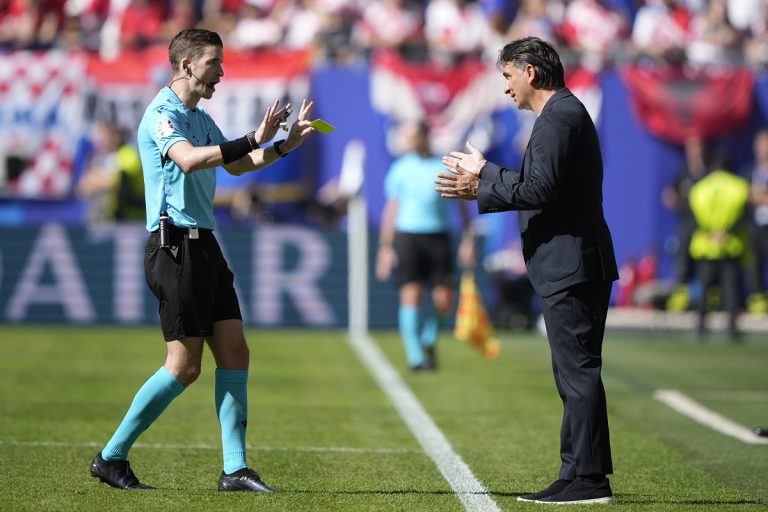 Croatia's head coach Zlatko Dalic, right, talks to French referee Francois Letexier during a Group B match between Croatia and Albania at the Euro 2024 soccer tournament in Hamburg, Germany, Wednesday, June 19, 2024. The match ended in a 2-2 draw. (AP Photo/Ebrahim Noroozi)