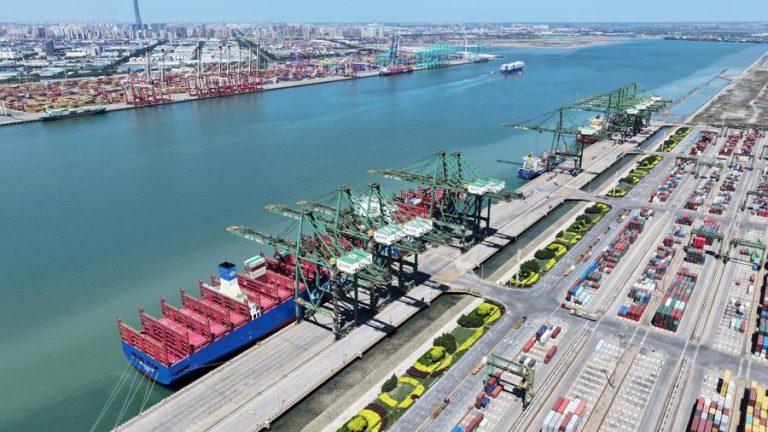 (240516) --BEIJING, May 16, 2024 (Xinhua) -- An aerial drone photo taken on May 15, 2024 shows the container ship COSCO Shipping Camellia at the Pacific International Container Terminal of Tianjin Port in north China's Tianjin. A container ship departed from north China's Tianjin Port on Wednesday, marking the opening of a new shipping route between Tianjin and the East Coast of the United States. (Xinhua/Zhao Zishuo)