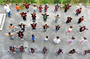 (240909) -- GUIYANG, Sept. 9, 2024 (Xinhua) -- Meng Rongda watches students exercise during a break at Zhongzhai teaching site in Xishan Township of Congjiang County, southwest China's Guizhou Province, Sept. 6, 2024.
  Meng Rongda, 59, is the only teacher of a "mini-school," more precisely a teaching site in Xishan Township of Congjiang County. At present, there are 23 preschool students and 17 pupils in the first and second grades.
  Besides Chinese and math, Meng is also responsible for physical education (PE) and music courses to ensure rural children can also attain a sound basic education.
  Meng has been working as a teacher, cook and caretaker at the mini-school since 2015 in the landlocked mountainous areas. To him, education can change the fate of children and therefore, he devotes himself to lighting up the way ahead for these rural children. (Xinhua/Yang Wenbin)