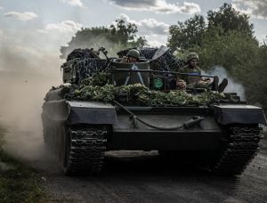 Ukrainian servicemen ride a military vehicle, amid Russia's attack on Ukraine, near the Russian border in Sumy region, Ukraine August 11, 2024. REUTERS/Viacheslav Ratynskyi