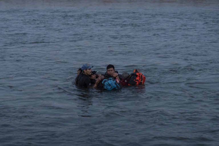 A group of migrants hold onto each other as they are swept downstream while attempting to cross into Eagle Pass, Texas, U.S. This was the first of two failed
crossing attempts made by this group who nearly drowned in the rushing current. Among the group were Widman Alexander Tax Chinic (center) and his fiancé
Rossana Azucena Coché Navichoc, 25. This couple from Guatemala became separated from the group, were swept downstream by the strong current and later found dead in Piedras Negras, Coahuila, Mexico, February 24, 2024. REUTERS/Cheney Orr