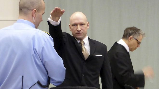 Breivik gives Nazi salute in court return to challenge jail isolation