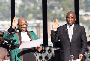 South Africa's Cyril Ramaphosa (R) gestures takes the oath of office for his second term as South African President at the Union Buildings in Pretoria on June 19, 2024. (Photo by Kim LUDBROOK / POOL / AFP)