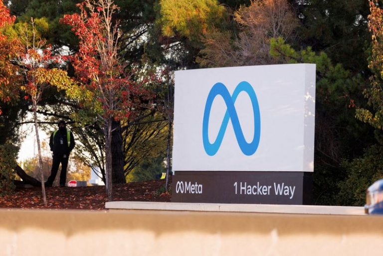 FILE PHOTO: A  security guard stands watch by the Meta sign outside the headquarters of Facebook parent company Meta Platforms Inc in Mountain View, California, U.S. November 9, 2022.  REUTERS/Peter DaSilva/File Photo