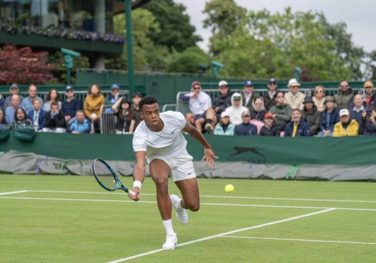 Jul 2, 2024; London, United Kingdom; Giovanni Mpetshi Perricard of France returns a shot during his match against Sebastian Korda of the United States (not shown) on day two of The Championships at All England Lawn Tennis and Croquet Club. Mandatory Credit: Susan Mullane-USA TODAY Sports